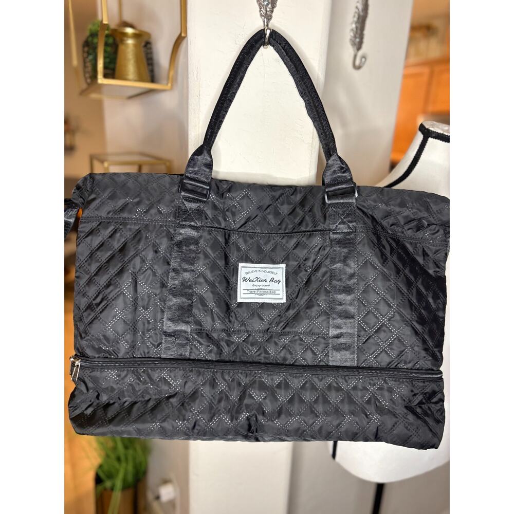 black quilted duffel bag by WeiXier